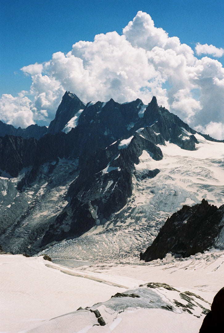 Analog photo print on Fujifilm paper featuring the towering peaks of the Mont Blanc massif, showcasing the rugged, snow-capped summits against the sky.