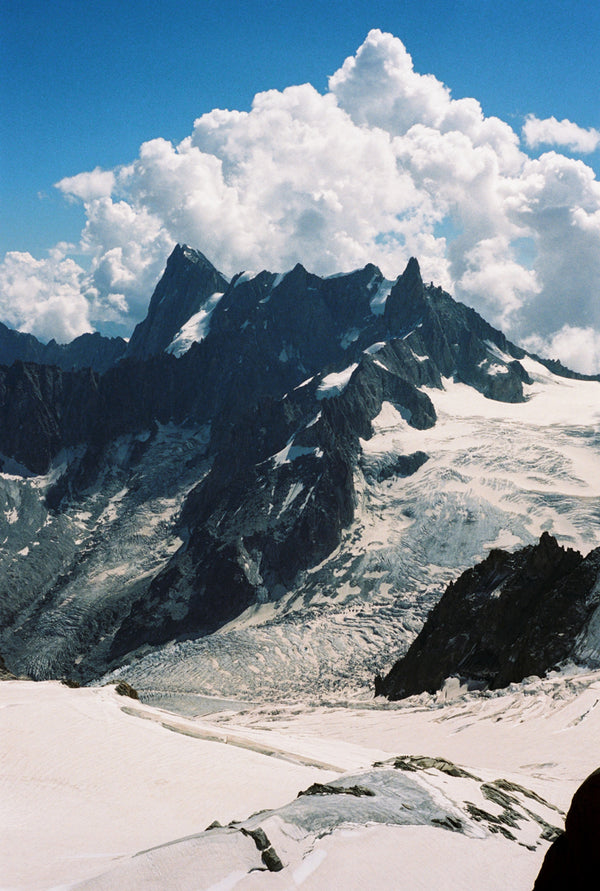 Analog photo print on Fujifilm paper featuring the towering peaks of the Mont Blanc massif, showcasing the rugged, snow-capped summits against the sky.