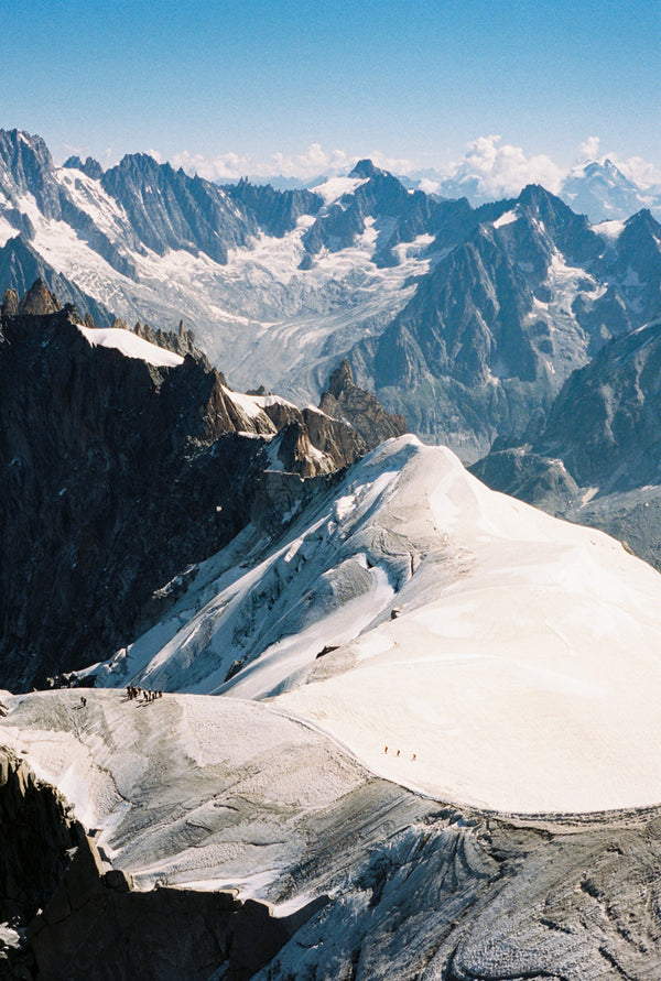 Analog photo print on Fujifilm paper featuring climbers navigating the ridges of Mont Blanc in the French Alps. Captured from the Aiguille du Midi at 3842 meters.